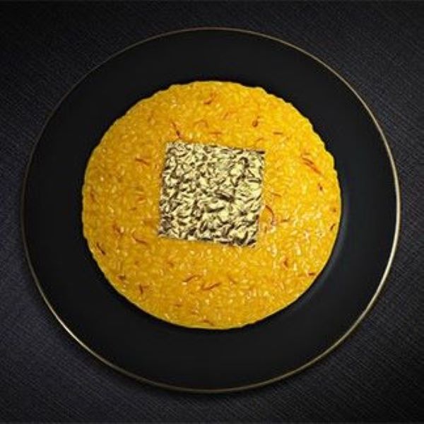 a plate of food on a black surface
