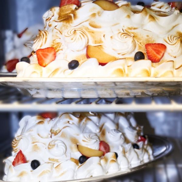 a cake with fruit on a tray