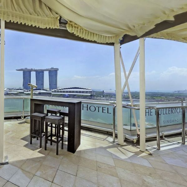 a table and chairs on a roof