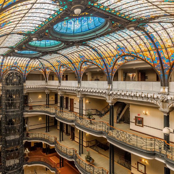 a multi story building with stained glass ceiling