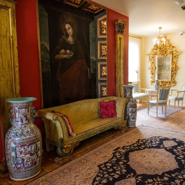 a room with a painting on the wall