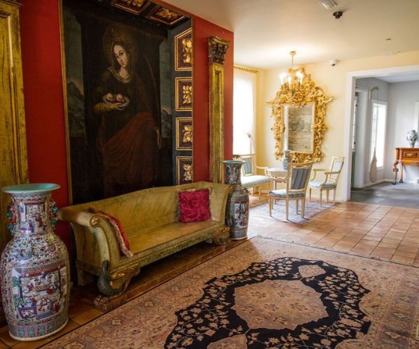 a room with a painting on the wall