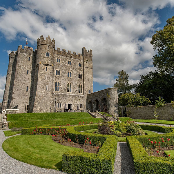 a castle with a garden and a path