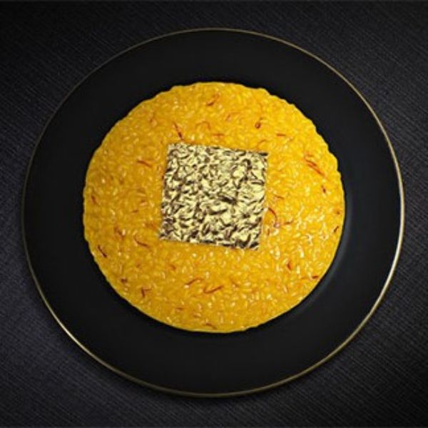 a plate of food on a black surface