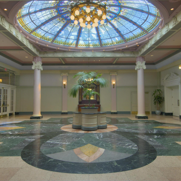 a large room with a stained glass skylight
