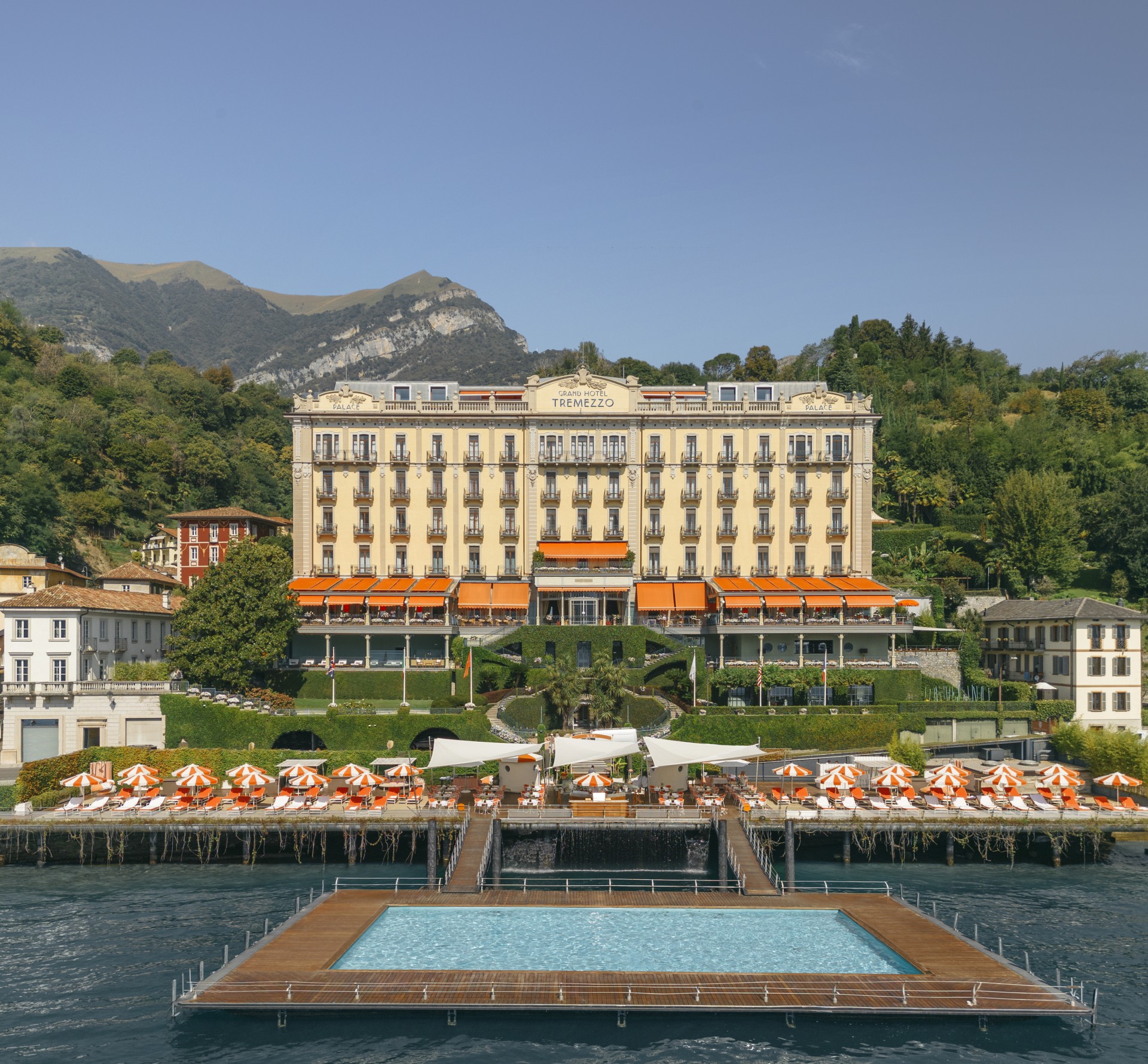 a pool with a large building in the background