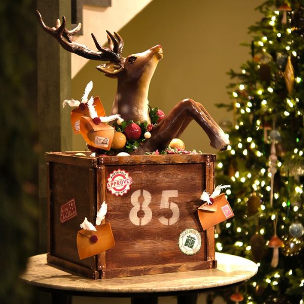a wooden box with a reindeer on it