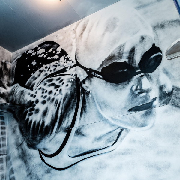 a mural of a woman in goggles