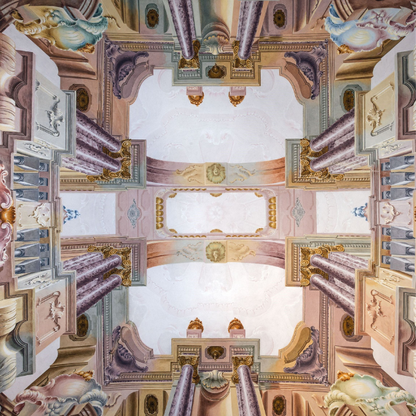 a ceiling with columns and arches