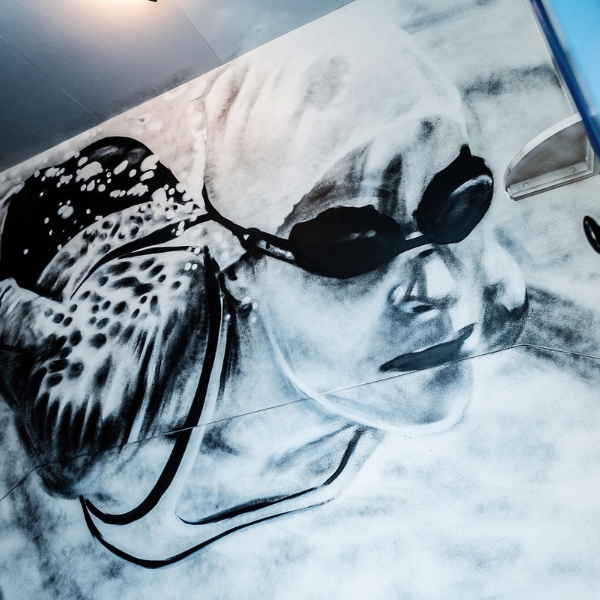 a drawing of a person with goggles on a wall