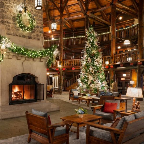 a room with a fireplace and a christmas tree
