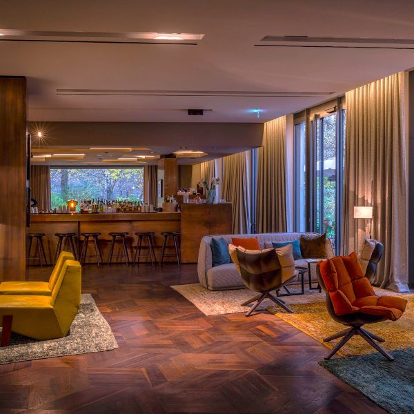 a room with a bar and chairs