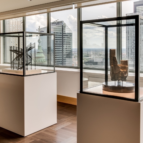 a glass cases with a statue in it