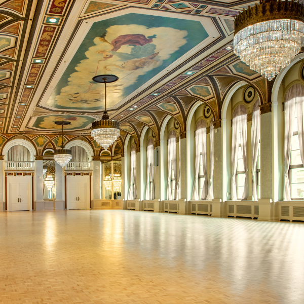 a large room with chandeliers and ceiling