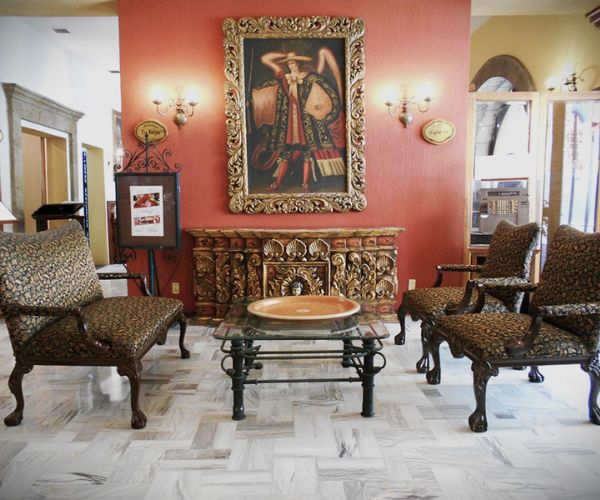 a room with a painting on the wall