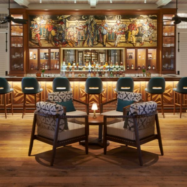 a bar with chairs around a table