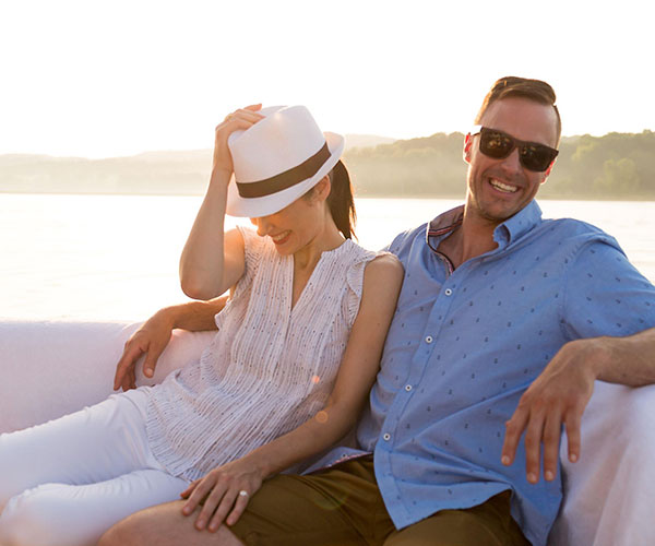 a man and woman sitting on a boat