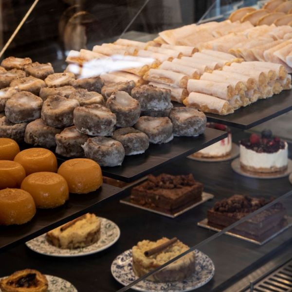 a display case with pastries and desserts
