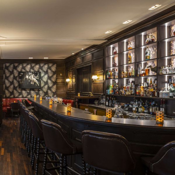 a bar with a bar and shelves of liquor