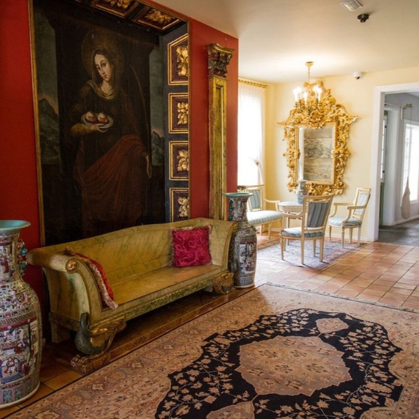 a room with a painting on the wall
