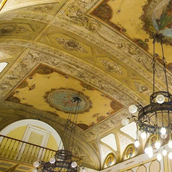 a ceiling with a painting on the ceiling