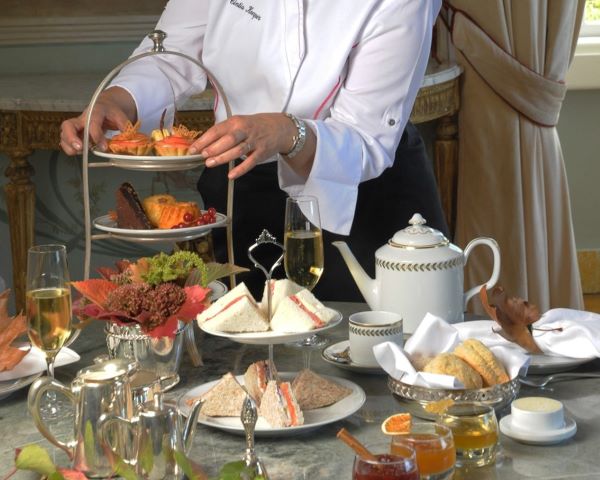 a person serving food on a table