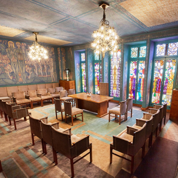 a room with many chairs and a table