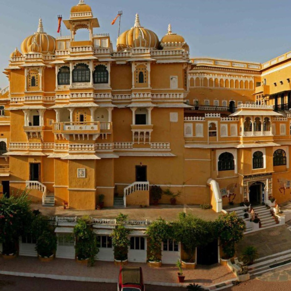 a large yellow building with a few windows