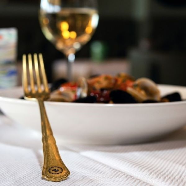 a fork in a bowl of food