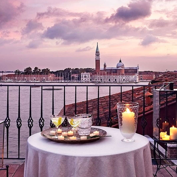 a table with candles and glasses on it