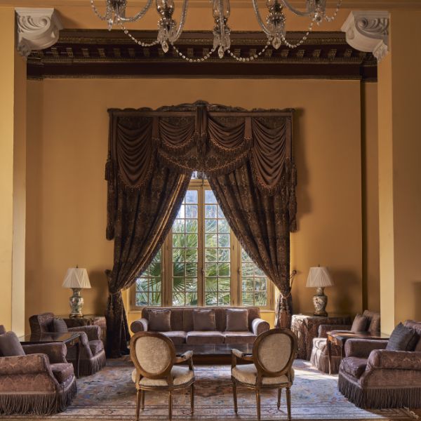 a room with a couch and chairs