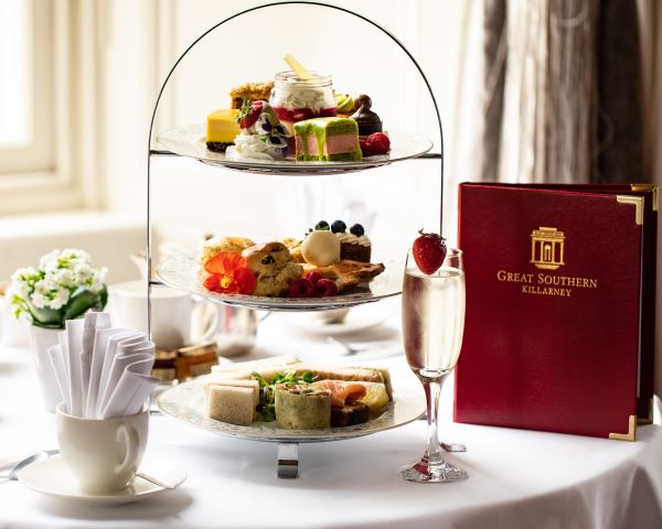 a three tiered tray with food on it