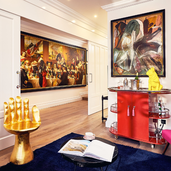 a room with a painting and a bar
