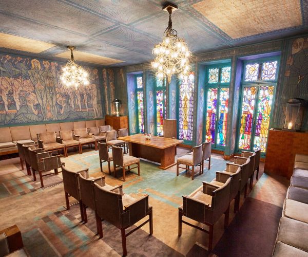 a room with many chairs and a table
