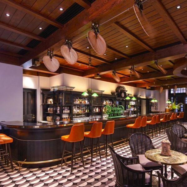 a bar with chairs and tables