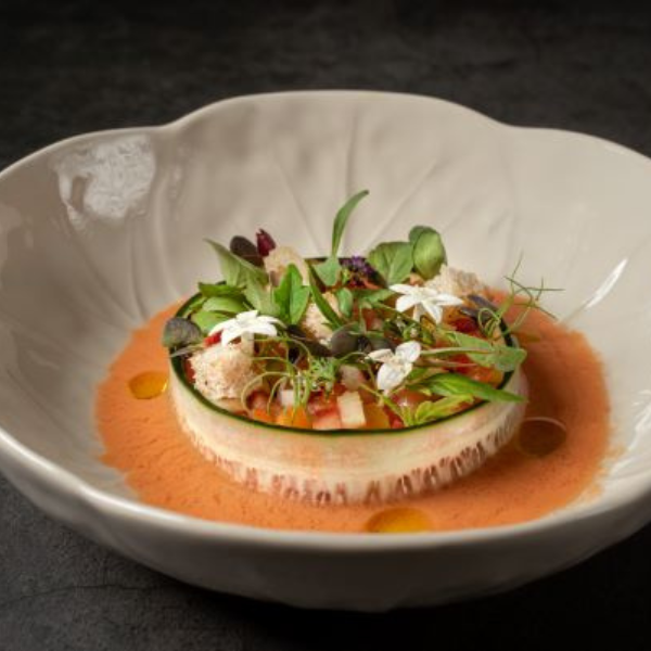a bowl of food with flowers on it