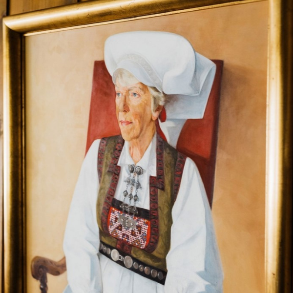 a painting of a woman in a gold frame