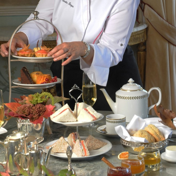 a chef serving food on a table