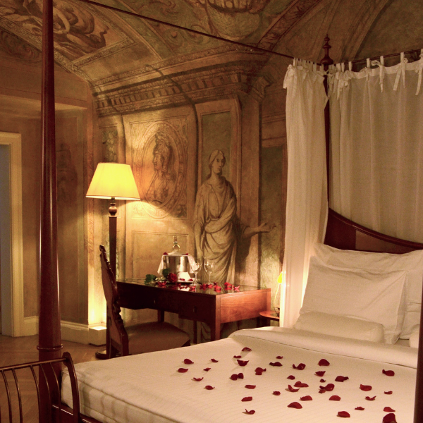 a bed with rose petals on it