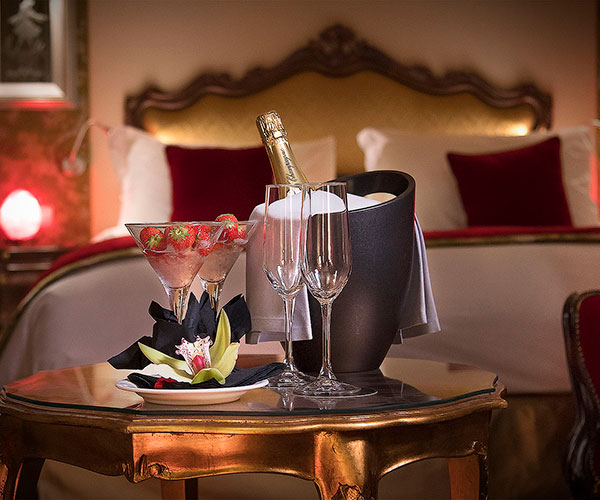 a champagne bottle and glasses on a table