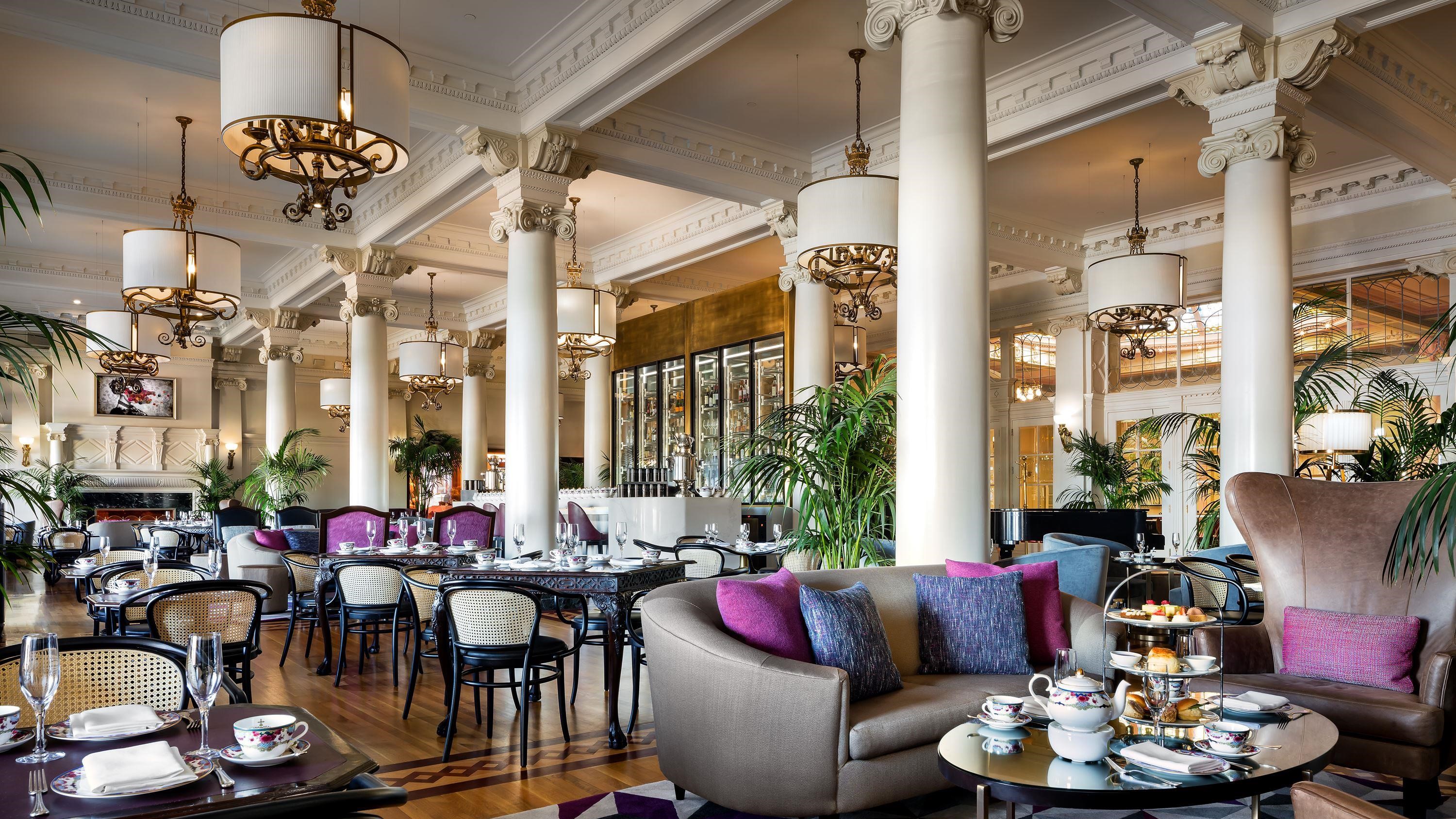 a room with a large white ceiling and columns