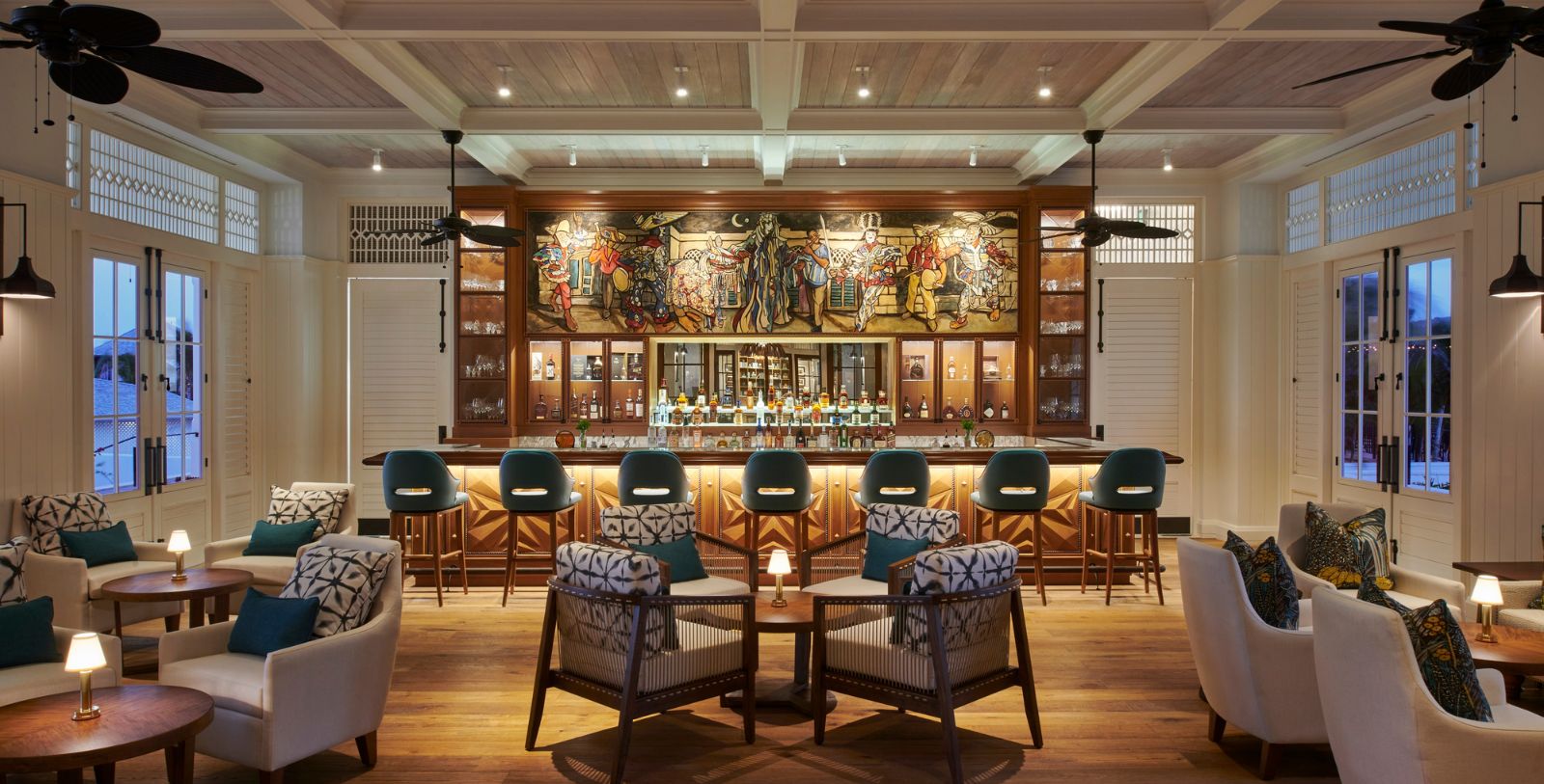 a room with a bar and chairs