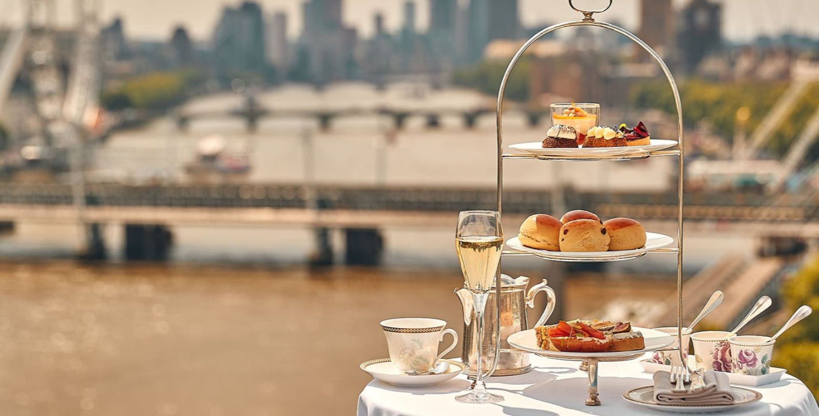a three tiered tray with food on it