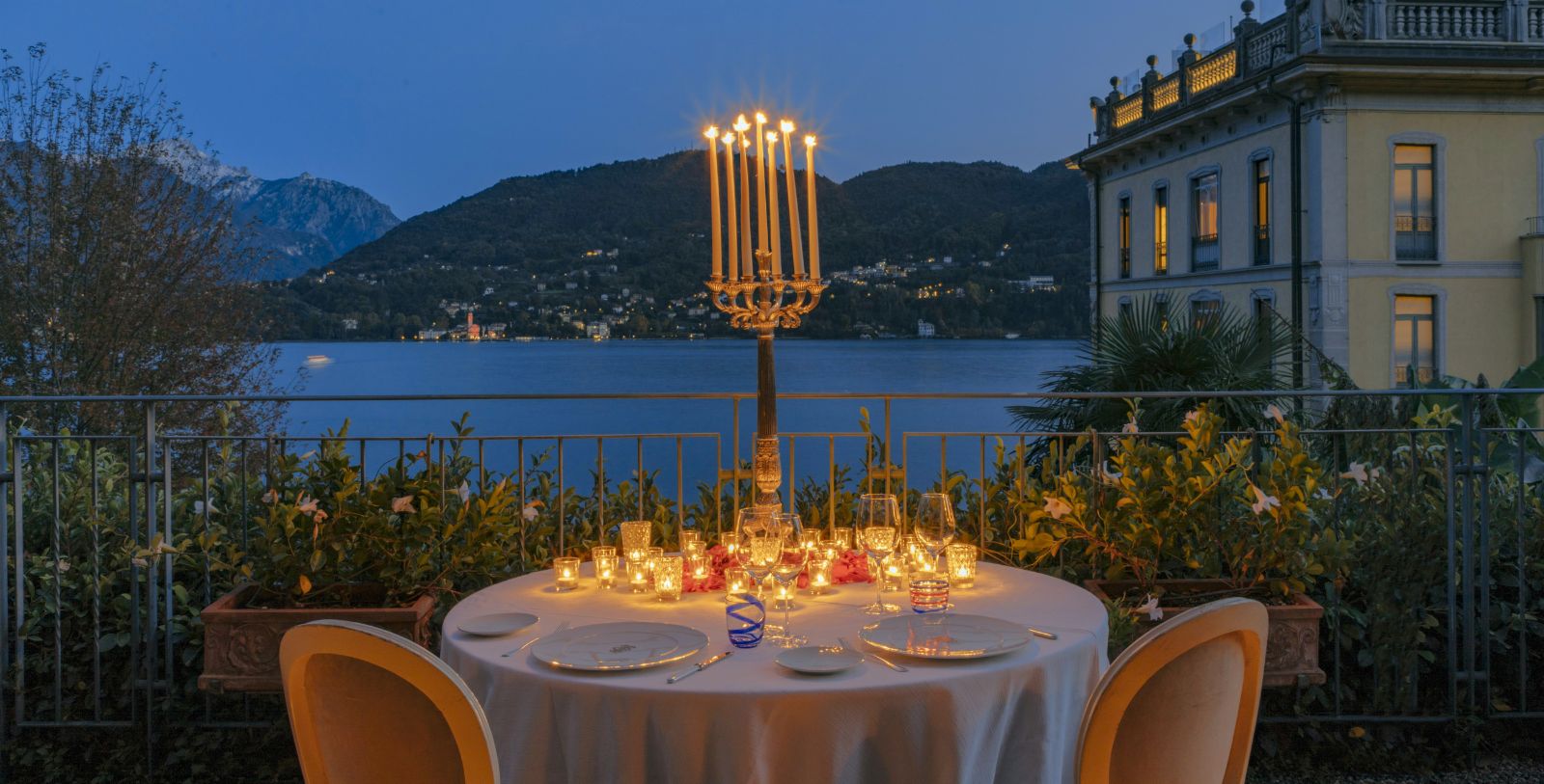 a table with candles on it and a candle holder on it