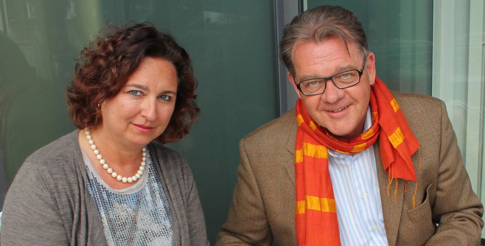a man and woman smiling for a picture