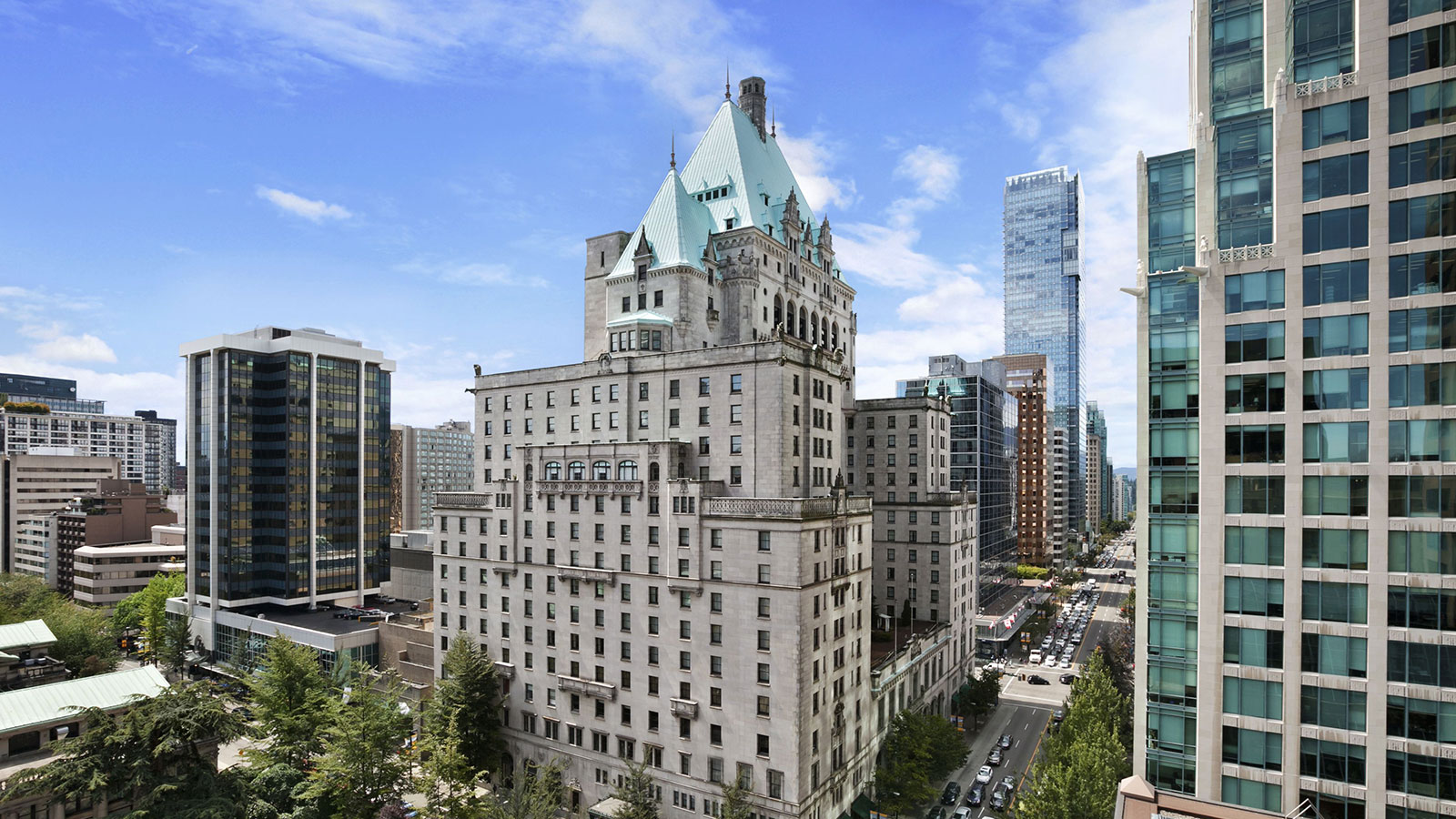 a large building with many windows and a street in the background 25