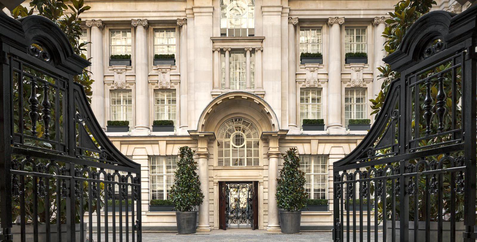 a large building with a gated entrance 14