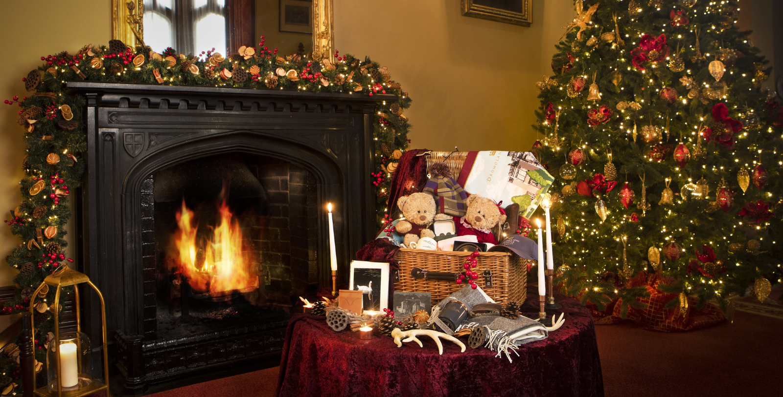 a fireplace with a basket of teddy bears and candles