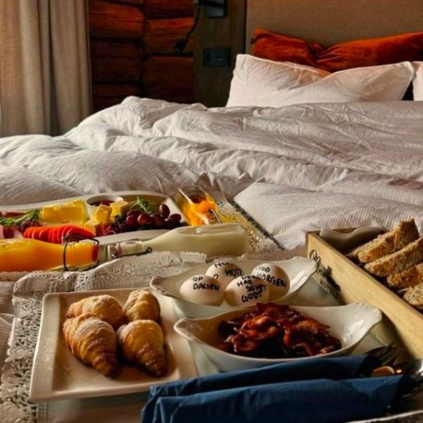 a tray of food on a bed