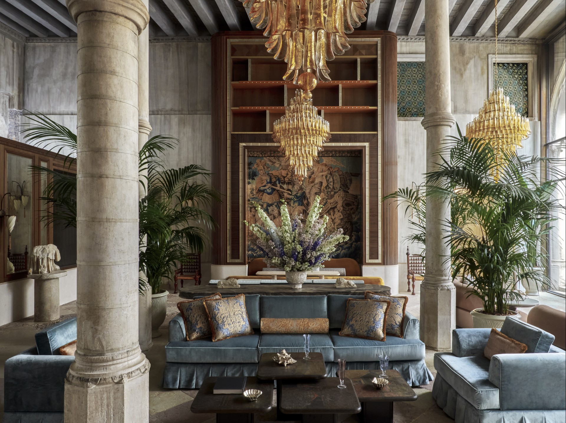 a room with a couch and chandelier